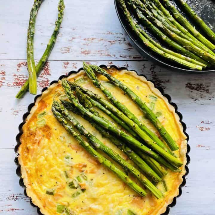 Quiche topped with roasted asparagus
